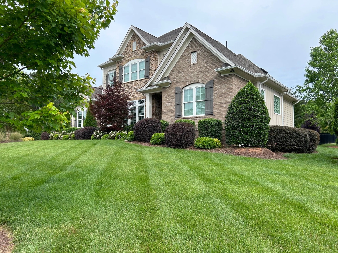 Finished striped lawn by Envision Landscaping