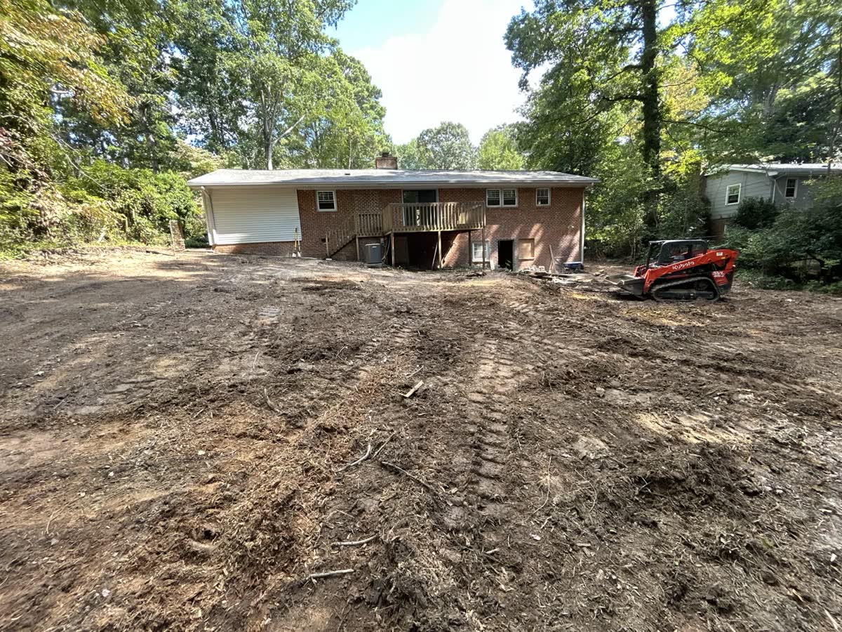 Bare graded backyard before lawn renovation work